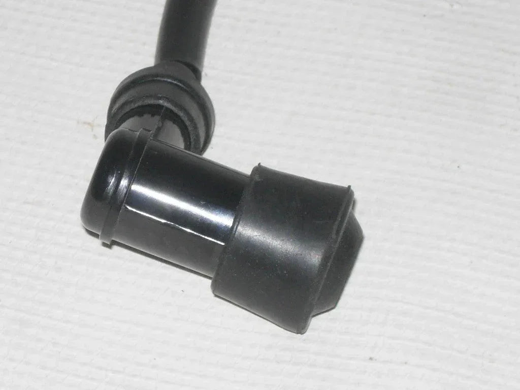 260 CC coil from unknown brand, showing close-up of the metal spiral with detailed wiring and connection points.