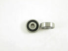 Close-up of a metal bearing showing its inner and outer rings, used in mechanical and automotive applications.