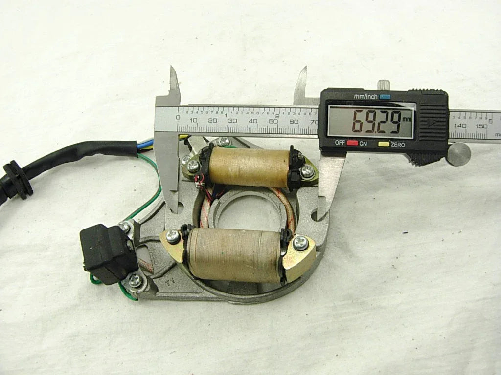 Two-coil magneto stator and rotor for 50cc, 110cc, and 125cc dirt bikes, compatible with various small motorcycle models.