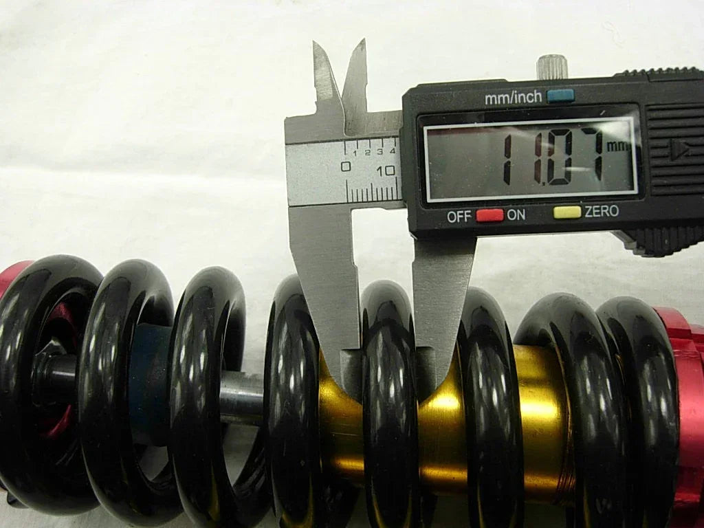 265mm air shock absorber for dirt bikes, durable suspension component from vendor-unknown, designed for off-road riding.