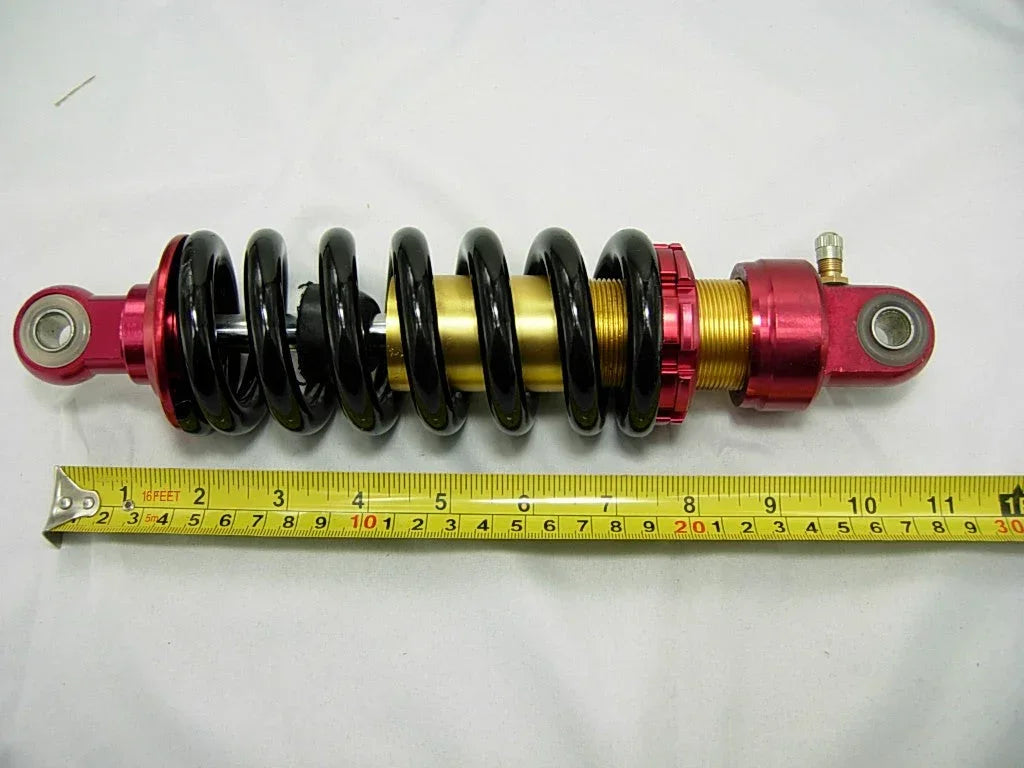 26cm dirt bike rear shock absorber, off-road vehicle suspension part, vendor-unknown brand, for enhanced riding comfort and control.