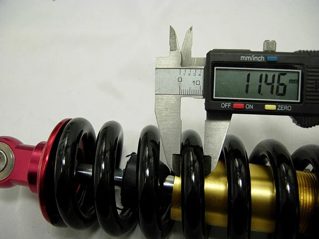 26cm rear shock absorber for dirt bikes, durable suspension part suitable for off-road riding and bike performance.