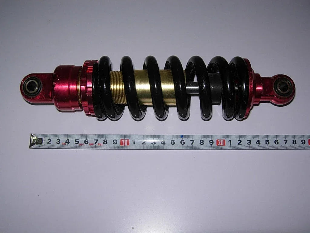 26cm rear shock absorber for dirt bikes, compatible with off-road motorcycle suspension systems, vendor-unknown brand.