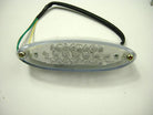 Oval clear plastic LED light with 24 bulbs and attached black cable with green and yellow wires