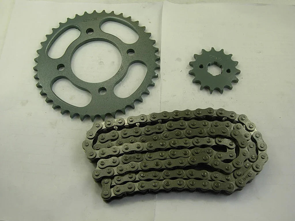 motorcycle sprocket set with large and small sprockets and a linked metal chain on white background
