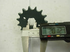 Digital caliper measuring a black metal sprocket gear with 20.12 mm diameter