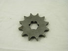Metal sprocket gear with 11 teeth on white fabric background, industrial mechanical part
