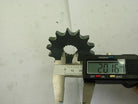 Digital caliper measuring 20.16 mm on a black steel gear with 12 teeth marked 428-14
