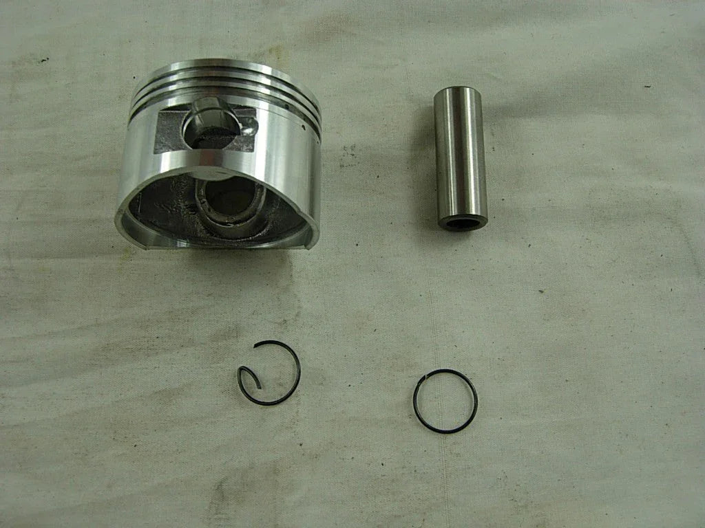 Dirt bike piston for 125cc engine, compatible with various models, shown in black metal with precision machining details.