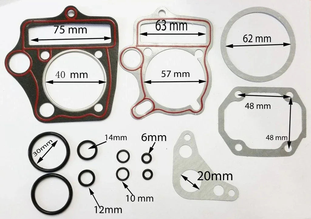 Dirt bike repair gasket set with cylinder seals for 50cc engine, suitable for small motorcycle maintenance and repairs.