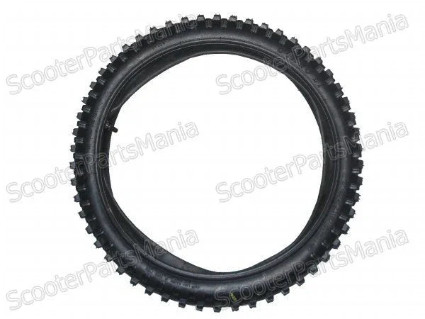 Black off-road scooter tire with aggressive tread pattern for enhanced grip