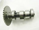 Metal camshaft with gear and bearings on a white background