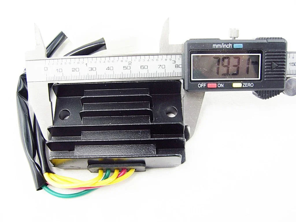 digital caliper measuring 79.31mm on black electronic heat sink with yellow, green, and red wires