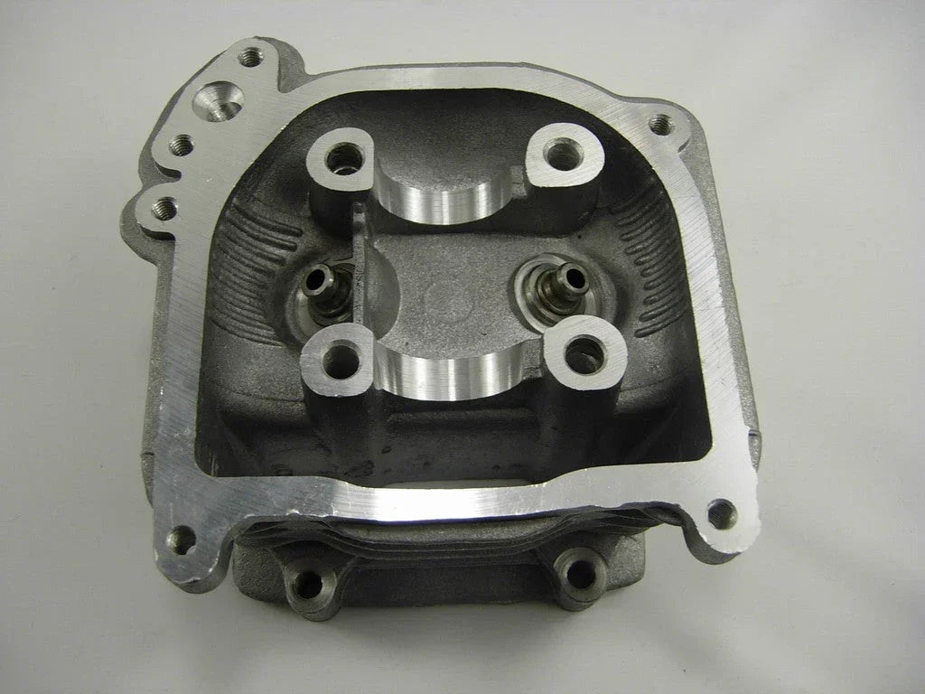 EGR style cylinder head for GY6 50cc and 60cc engines, used in scooter engine parts, with visible metal components and bolt holes.
