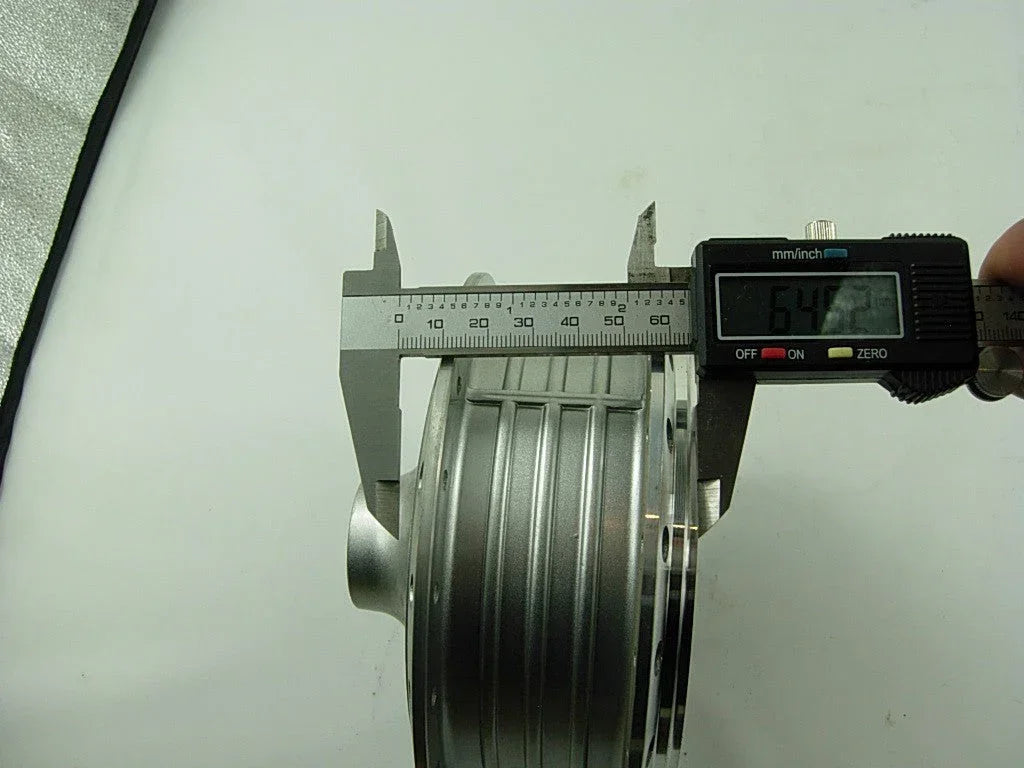 Front wheel hub for A100 engine motorcycle, made of metal, with spokes and mounting points, designed for motorcycle front wheel assembly.