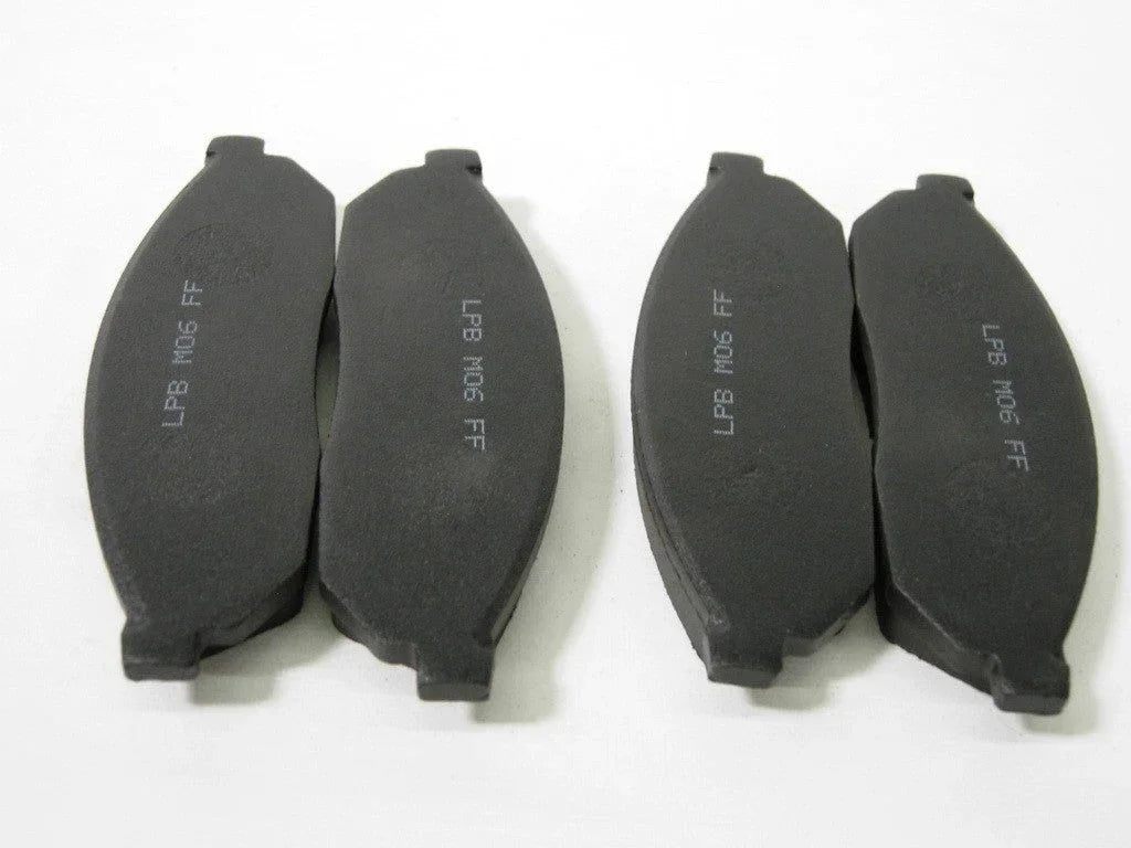 Set of four mini pocket moto rear brake pads, compatible with small motorcycle models, designed for reliable stopping power.