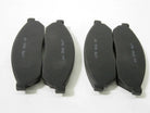 Set of four mini pocket moto rear brake pads, compatible with small motorcycle models, designed for reliable stopping power.