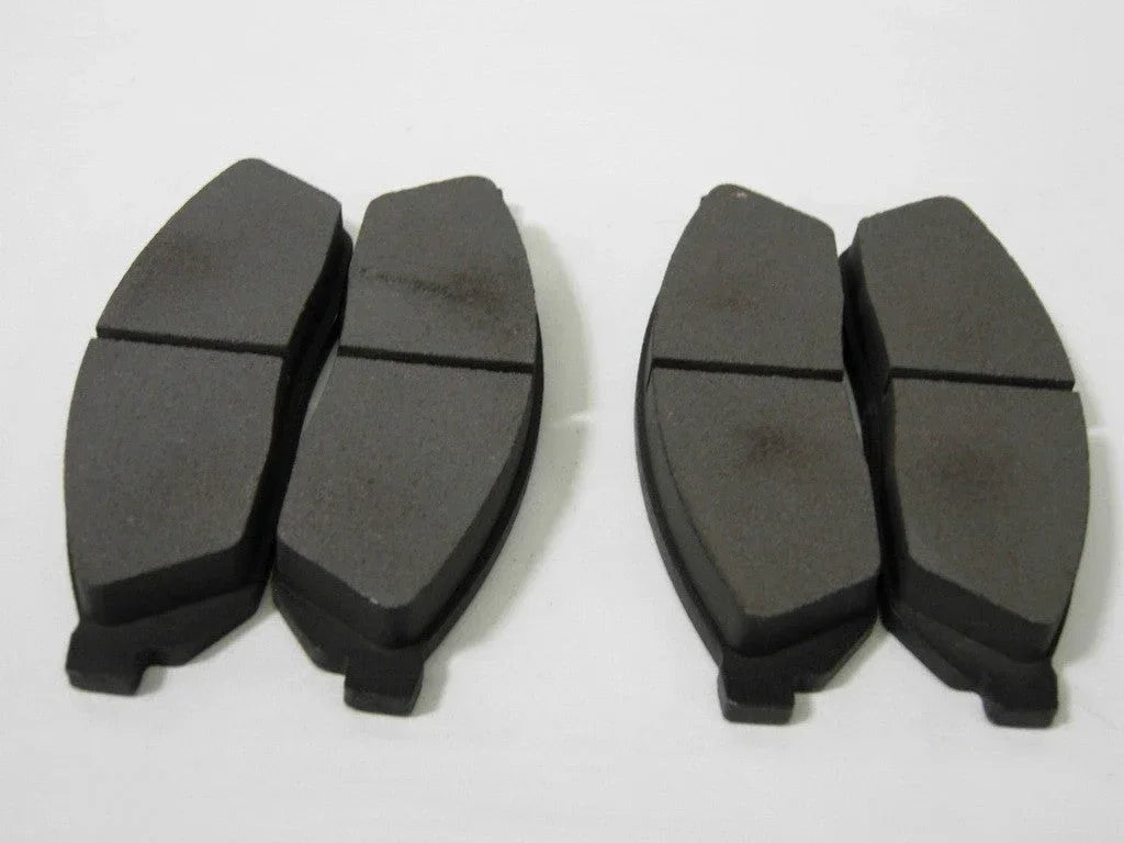 Set of four mini pocket moto rear brake pads, motorcycle parts with durable friction material for reliable stopping power.