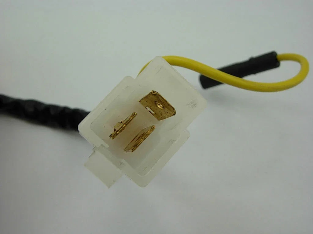 Close-up of a 3-pin stator magneto electrical connector for 250cc motorcycle or ATV