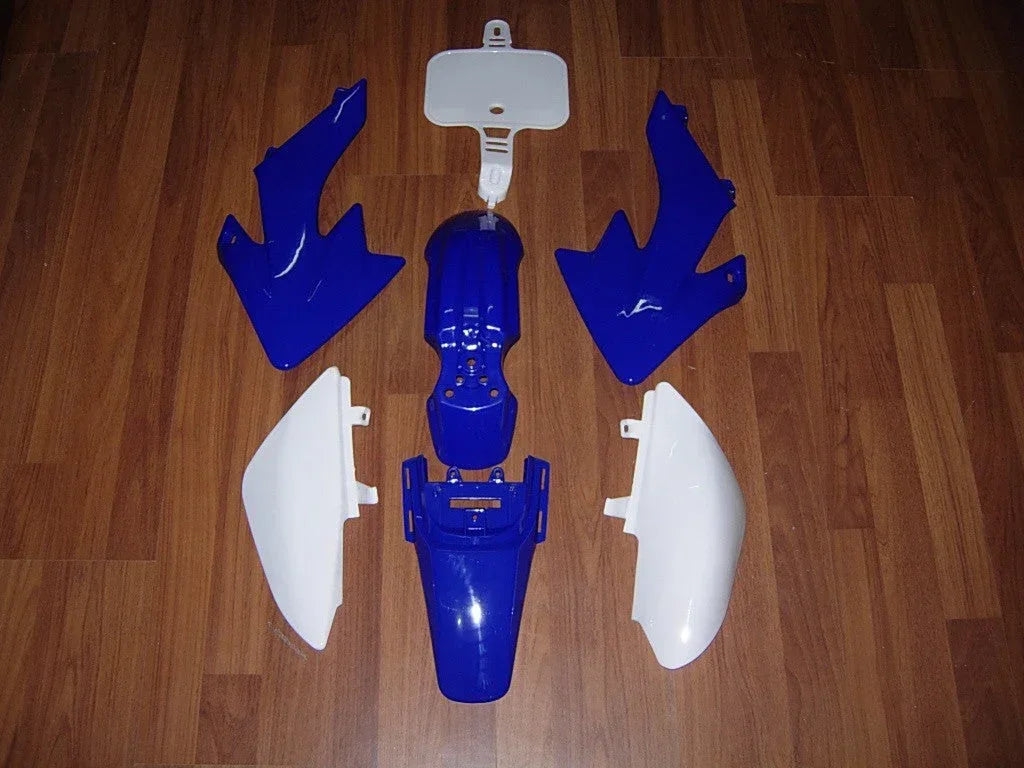 Reserve parts fairing for motorcycle, black plastic cover with mounting points, compatible with various models.