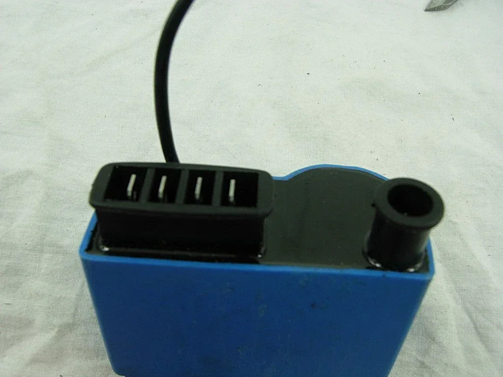 Universal ignition coil assembly for VESPA, showcasing its compact design and electrical connections.